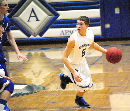 Auburndale's Matt Nikolay surveys the Assumption defense during the Apaches' 54-44 win on Thursday at Auburndale High School. (Photo by Paul Lecker/MarshfieldAreaSports.com)