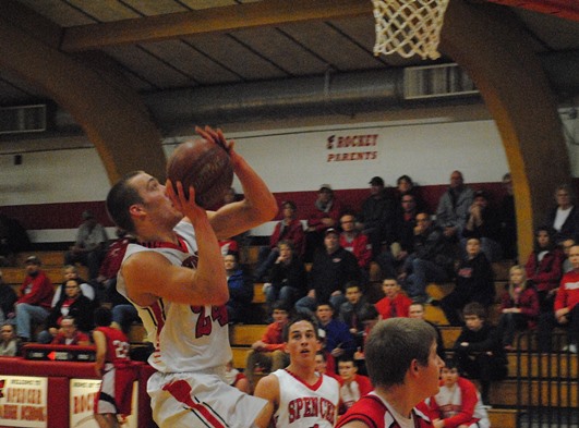 Spencer's Ryan Busse drives in for a layup during the Rockets' 30-point win over Greenwood on Thursday night at Spencer High School. (Photo by Paul Lecker/MarshfieldAreaSports.com)