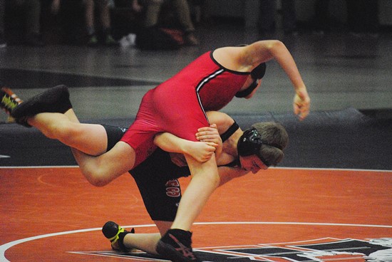 Marshfield's Caden Dennee throws Stevens Point's Xavier Klein on his way to a pin in the 106-pound match during Thursday's dual meet at Marshfield High School. Stevens Point won 36-31. (Photo by Paul Lecker/MarshfieldAreaSports.com)