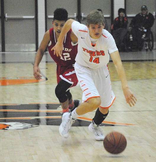 Marshfield's Grant Michaelis breaks away from the Wisconsin Rapids defense during the second half of Friday's game at Marshfield High School. Wisconsin Rapids went on to win 61-51. (Photo by Paul Lecker/MarshfieldAreaSports.com)