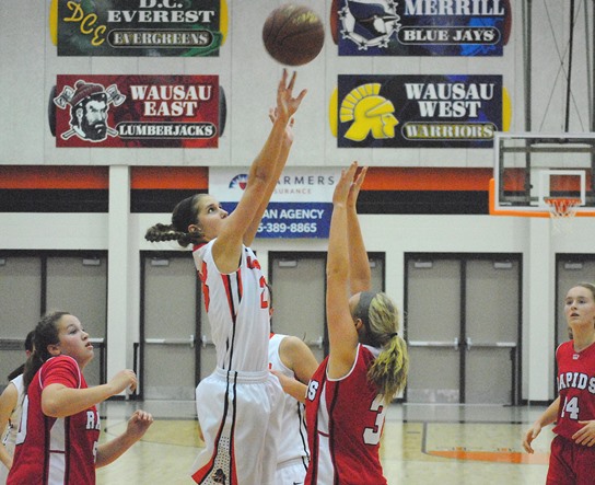 Marshfield's Maddie Nikolai rises above the Wisconsin Rapids defense for a shot during the Tigers' 56-40 win on Friday night at Marshfield High School. (Photo by Paul Lecker/MarshfieldAreaSports.com)