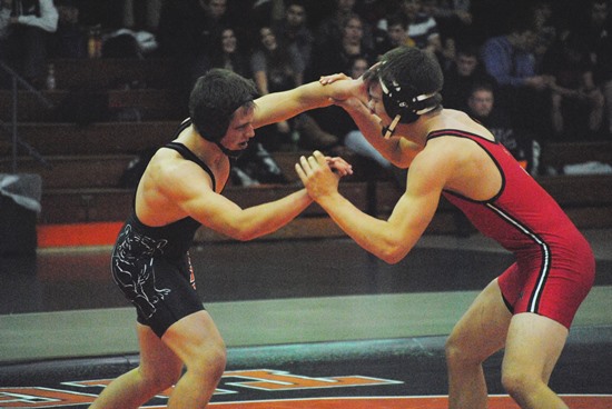 Marshfield's Conner Peterson, left, takes on Stevens Point's Jake Harlow during the 182-pound match of a dual meet recently at Marshfield High School. (Photo by Paul Lecker/MarshfieldAreaSports.com)