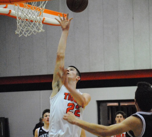 Marshfield's Adam Fravert goes inside for a basket during the Tigers' loss to No. 1-ranked Stevens Point on Friday night at Marshfield High School. (Photo by Paul Lecker/MarshfieldAreaSports.com)