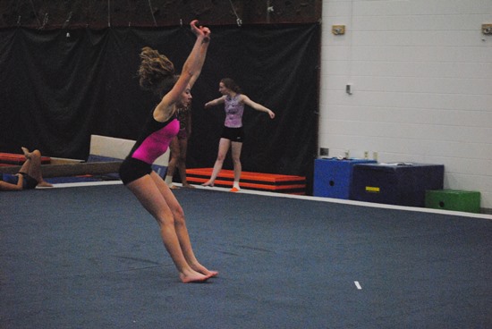 Marshfield senior Megan Smith practices her tumbling during a recent workout at Marshfield High School. (Photo by Paul Lecker/MarshfieldAreaSports.com)