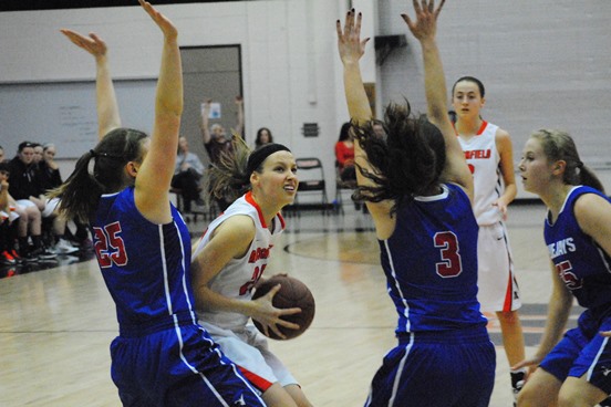 Marshfield's Ema Fehrenbach splits the Merrill defense during a game earlier this season at Marshfield High School. The Tigers are the No. 1 seed in their sectional and open the WIAA Division 1 playoffs Feb. 26 at home against Wisconsin Rapids. (Photo by Paul Lecker/MarshfieldAreaSports.com)