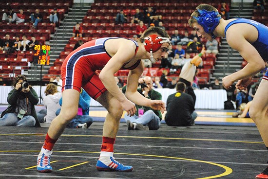 Spencer/Columbus senior, Austin Post, left, sets for battle against Lodi's Jacob Busser during a Division 2 132-pound preliminary match at the WIAA State Individual Wrestling Tournament on Thursday at the Kohl Center in Madison. Post was pinned in the second period. (Photo by Paul Lecker/MarshfieldAreaSports.com)