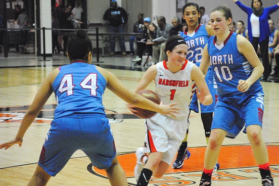 Marshfield's McKayla Scheuer drives into traffic late in the Tigers' 45-41 win over Eau Claire North in a WIAA Division 1 girls basketball regional final Saturday at Marshfield High School. (Photo by Paul Lecker/MarshfieldAreaSports.com)