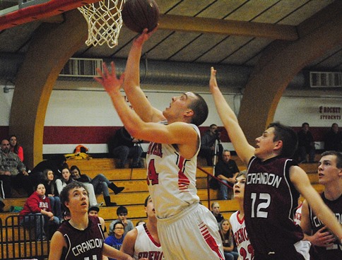 Spencer's Ryan Busse drives in for a layup during the Rockets' 66-61 win over Crandon in a WIAA Division 4 regional quarterfinal on Tuesday at Spencer High School. (Photo by Paul Lecker/MarshfieldAreaSports.com)