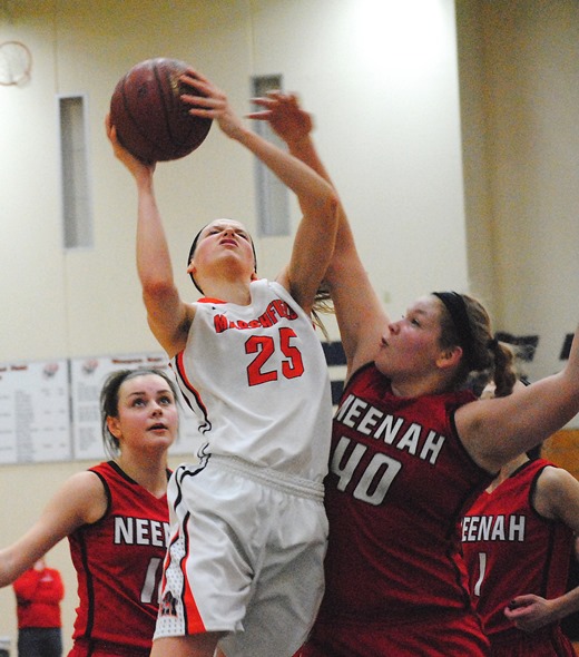 Marshfield's Ema Fehrenbach drives inside to score two of her game-high 30 points in the Tigers' 74-71 overtime win over Neenah on Thursday in a WIAA Division 1 sectional semifinal at Waupaca High School. (Photo by Paul Lecker/MarshfieldAreaSports.com)