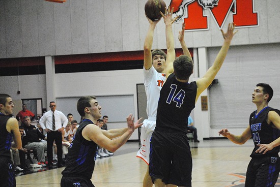 Marshfield's Grant Michaelis pulls up for a jumper during the first half of Friday's WIAA Division 1 regional semifinal against Oshkosh West at Marshfield High School. West won 75-72 in overtime. (Photo by Paul Lecker/MarshfieldAreaSports.com)