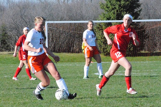 Marshfield's Julia Urban, left, returns to the Tigers after earning first-team all-Wisconsin Valley Conference honors a year ago. (Photo by Paul Lecker/MarshfieldAreaSports.com)