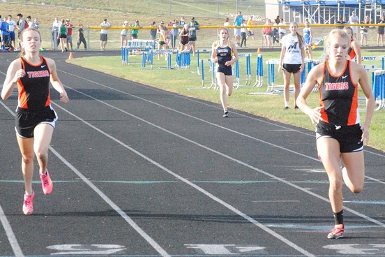 Marshfield's Alexa Aumann, right, slips past teammate Courtney Brown to finish second at in the girls 400 meters at the WIAA Division 1 Track & Field Regional on Monday at Wausau West High School. (Photo by Paul Lecker/MarshfieldAreaSports.com)