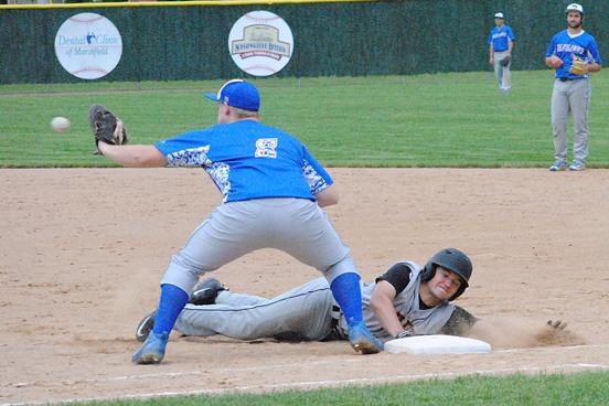 Marshfield's Mason Metz dives safely back into first base after a pickoff attempt during a WIAA Division 1 baseball regional semifinal Tuesday at Jack Hackman Field in Marshfield. The Tigers won 10-2. The Merrill first baseman is Christian Kleinschmidt. (Photo by Paul Lecker/MarshfieldAreaSports.com)