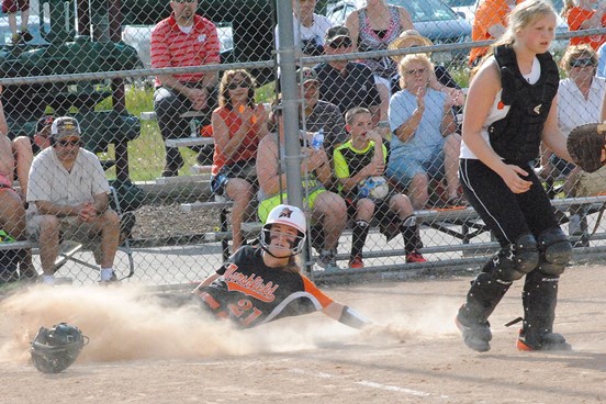 Marshfield's Morgan Nordbeck slides safely into home plate during the Tigers' 10-0 win over New Richmond in a WIAA Division 1 softball regional semifinal Tuesday at the Marshfield Fairgrounds. (Photo by Paul Lecker/MarshfieldAreaSports.com)