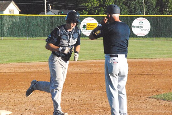 Marshfield Post 54’s Mitch Susa rounds third base and is congratulated by manager Tom Sorenson after hitting a home run during the first inning of the Blue Devils’ Legion baseball victory Tuesday at Jack Hackman Field. (Photo by Paul Lecker/MarshfieldAreaSports.com)