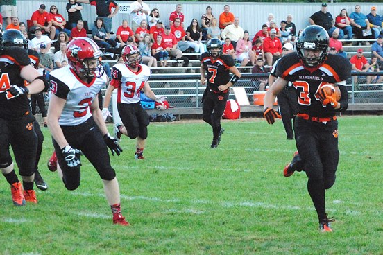 Marshfield running back Braden Bohman breaks around the left end to score the Tigers' first touchdown in a 48-13 rout of Wausau East on Friday night at Beell Stadium in Marshfield. (Photo by Paul Lecker/MarshfieldAreaSports.com)