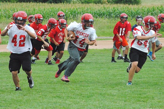 Spencer/Columbus Catholic running back Hunter Luepke carries the ball during the opening day of practice Tuesday at Spencer High School. (Photo by Paul Lecker/MarshfieldAreaSports.com)