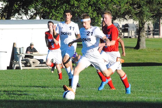 Columbus Catholic's Nick Malovrh uncorks a kick for a goal early in the second half of the Dons' 9-0 win over Wausau Newman Catholic on Thursday at Griese Park. (Photo by Paul Lecker/MarshfieldAreaSports.com)