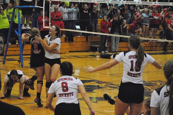 The Spencer volleyball team celebrates after winning the fifth set to defeated Marshfield Columbus Catholic 3-2 in a battle of Cloverbelt East unbeatens Thursday night at Columbus Catholic High School. (Photo by Paul Lecker/MarshfieldAreaSports.com)