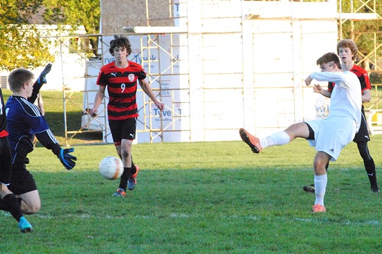 Marshfield's Ethan Leischow boots home the game-winning goal in the 85th minute as the Tigers beat Pulaski 1-0 in a WIAA Division 2 boys soccer regional final Saturday at Griese Park in Marshfield. (Photo by Paul Lecker/MarshfieldAreaSports.com)