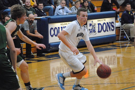 Columbus Catholic's Ryan Dieringer drives across the lane during the Dons' win over Colby on Tuesday night at Columbus Catholic High School. (Photo by Paul Lecker/MarshfieldAreaSports.com)