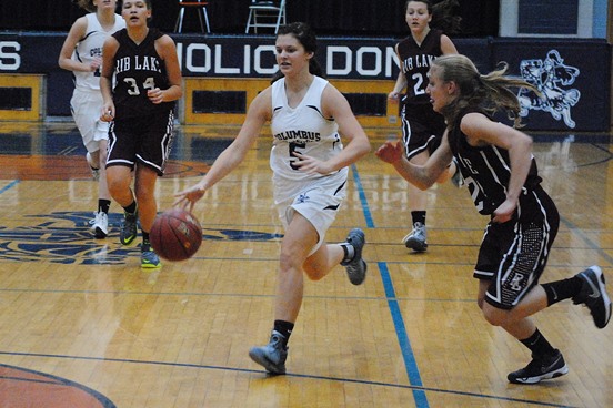 Columbus Catholic's Baylie Neider drives to the basket during the Dons' win over Rib Lake on Tuesday in the teams' season opener at Columbus Catholic High School. (Photo by Paul Lecker/MarshfieldAreaSports.com)